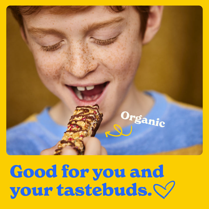 Good for you and your tastebuds: a child happily eating a chocolate drizzled bar