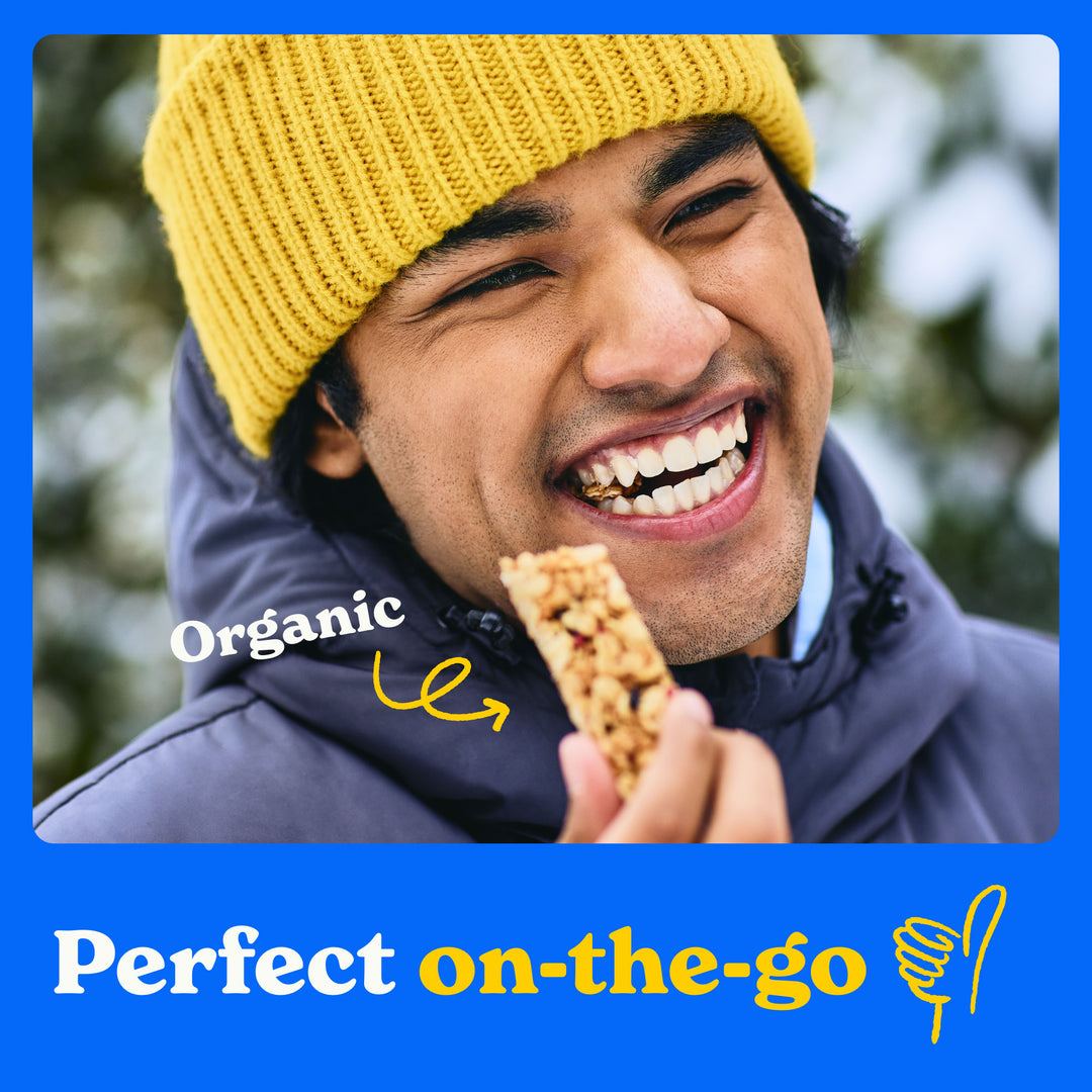 Perfect on the go: a man enjoying an organic granola bar