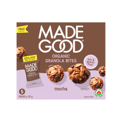 A box of MadeGood Organic Granola Bites in Mocha flavor. The packaging features a brown and lavender color scheme with images of the granola bites, highlighting chocolate chips and oats. Labels indicate that the product is nut-free, gluten-free, and a source of fiber. A yellow banner announces "50% MORE bites per pack," and a small Canadian organic certification seal appears at the bottom right.